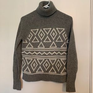 Cozy turtleneck sweater with geometric design